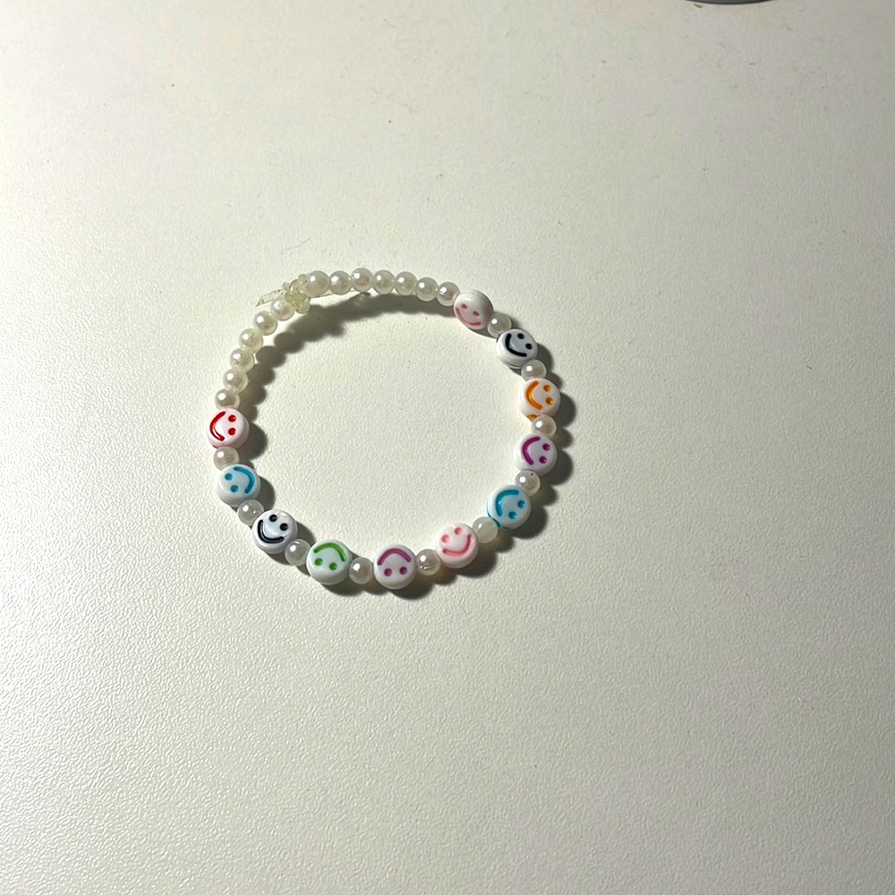 A handmade smiley face bracelet !<3